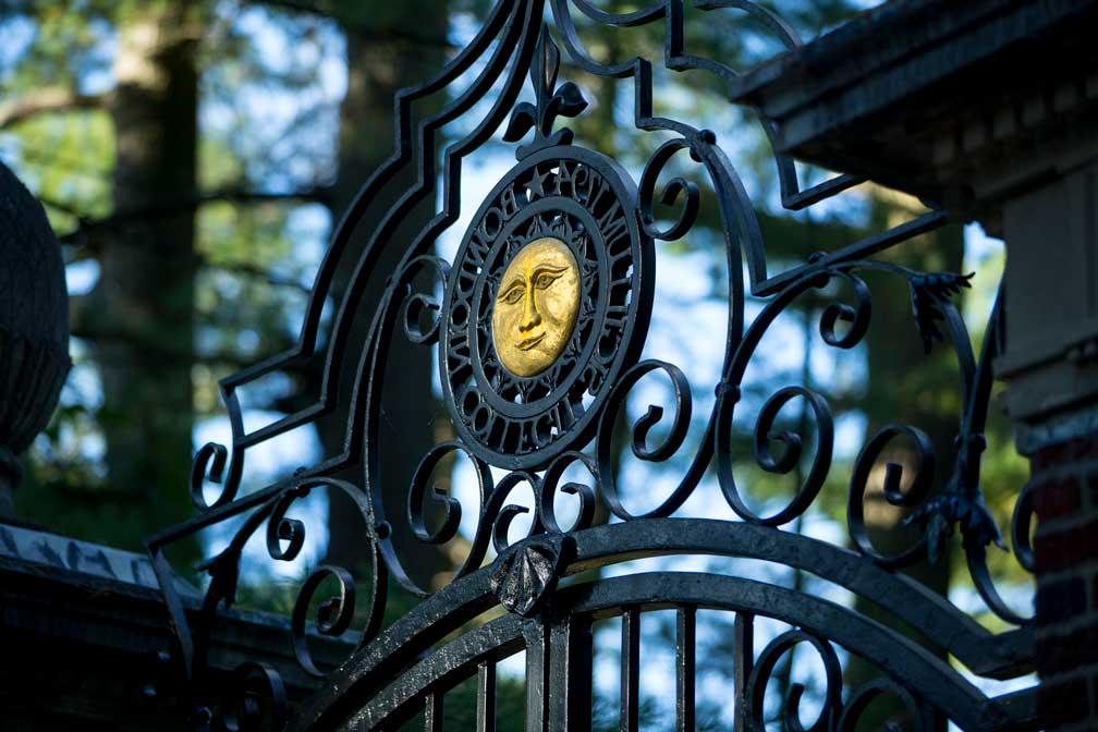 Bowdoin sun on wrought iron gate