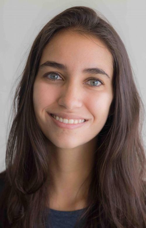 Photo of Brooke Wrubel, a closeup, smiling, with dark blue t-shirt and gray background