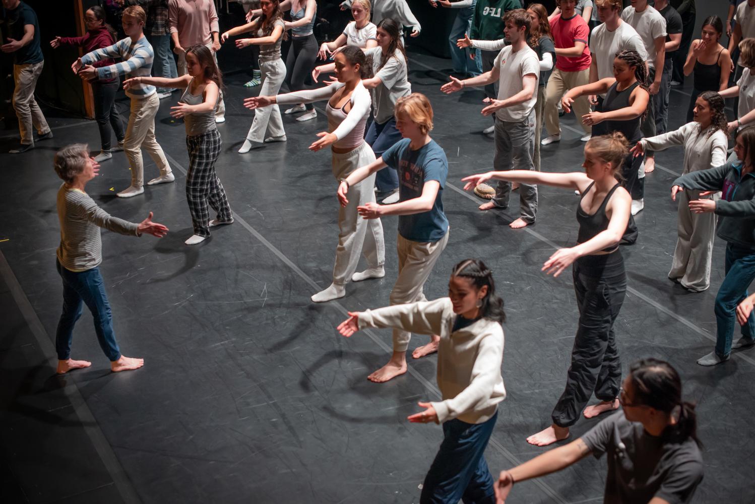 Students practicing dancing with teacher